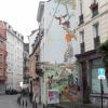 Project in Brussels to cheer up areas with a bad reputation by painting the walls with comic-strip characters.